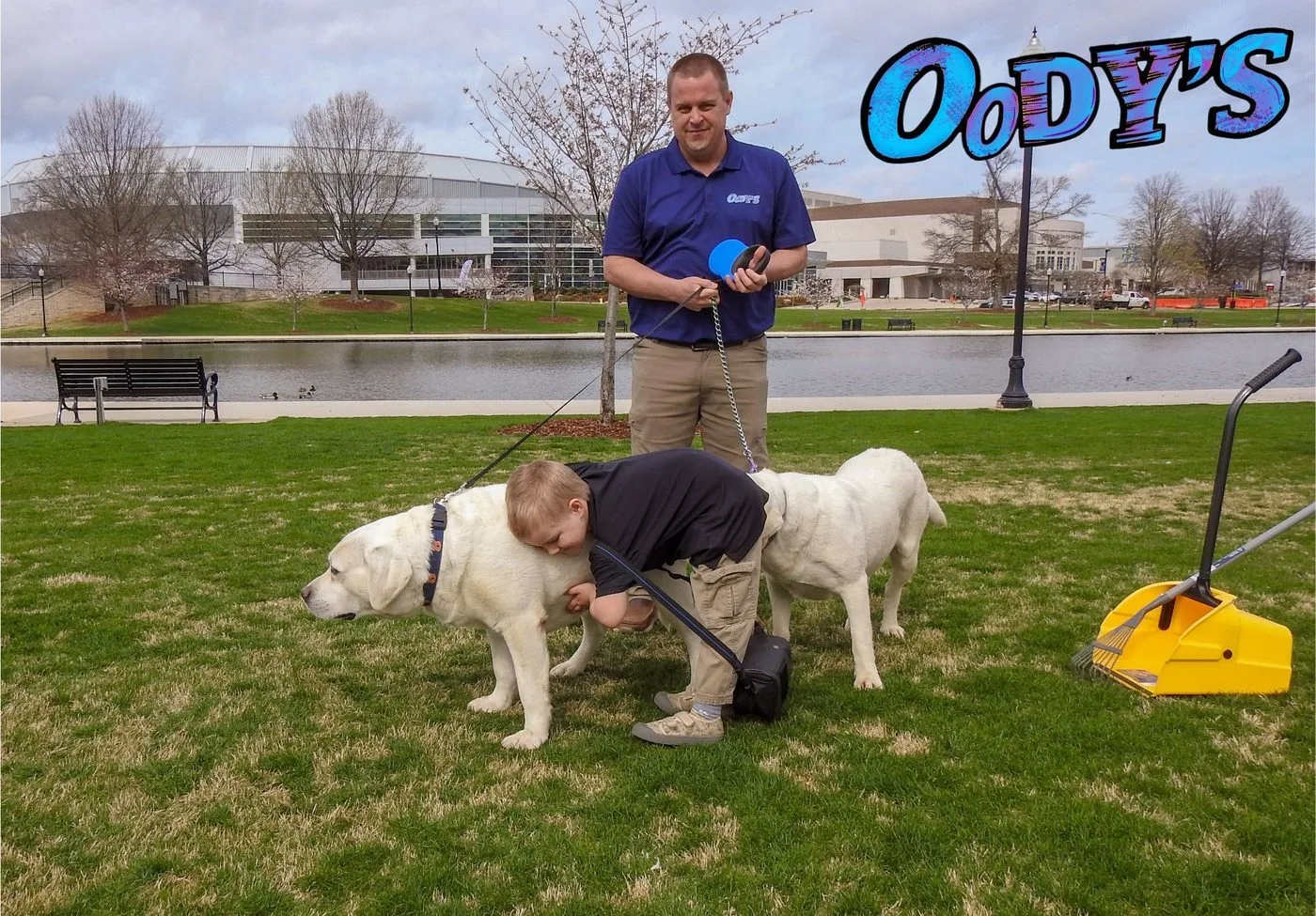 Two dogs caught in the act of doing their business in a yard